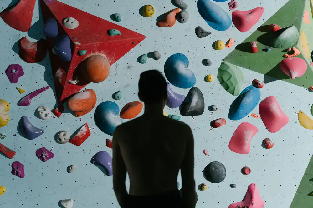 Climbing holds and geometric wall panels